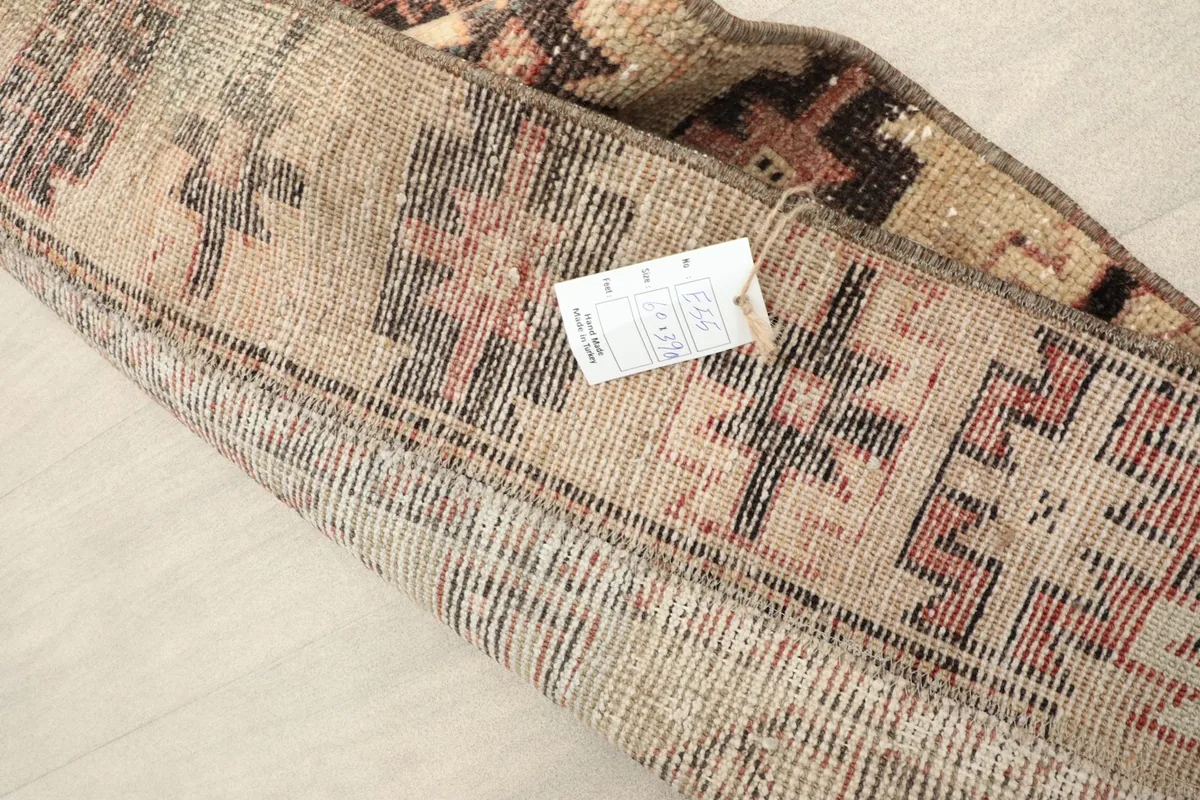 Close-up of the runner folded, showing the thickness of the wool pile and general condition