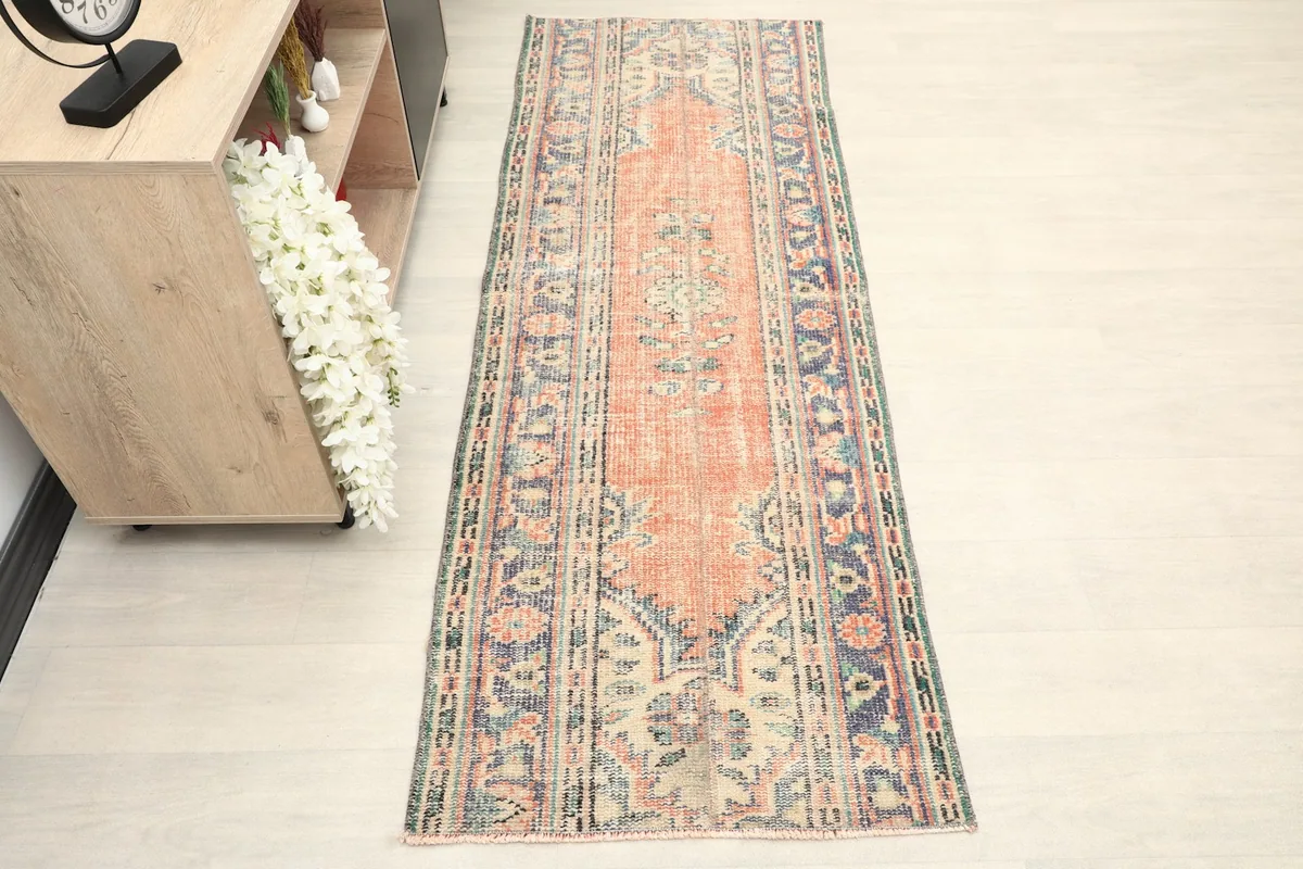 Overhead view showcasing the full length and design of the rust and navy runner.