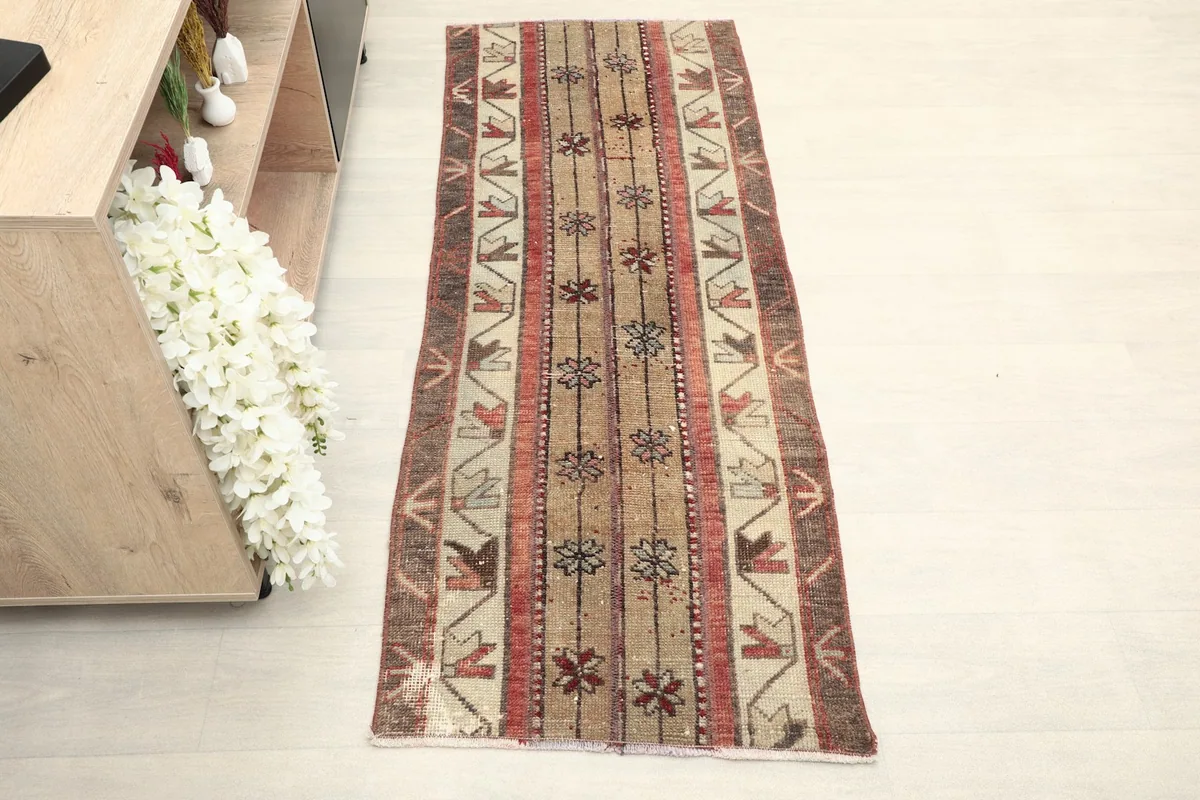 Direct overhead shot of the hand-knotted vintage wool runner with its geometric and floral patterns