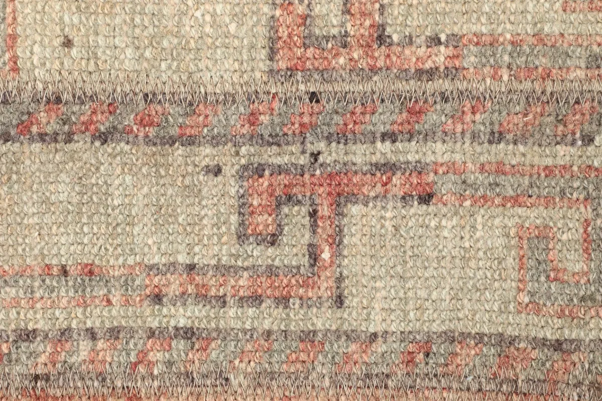 Detailed view of the rug's central design, showing the texture and subtle color shifts.