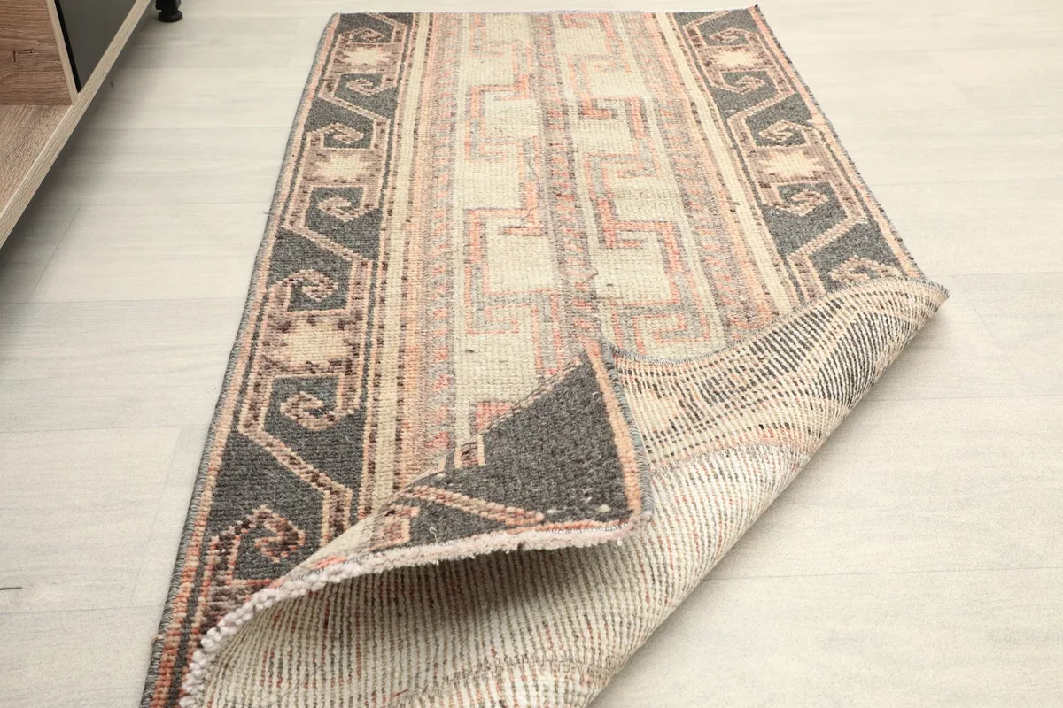 The rug folded to show its flexibility and the quality of the hand-knotted construction.