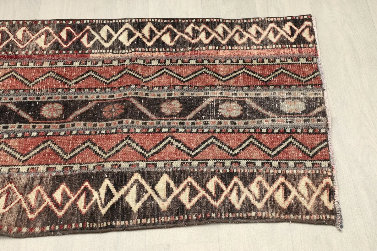 Overhead view of the other half of the rug, showing the consistent pattern and color variations.