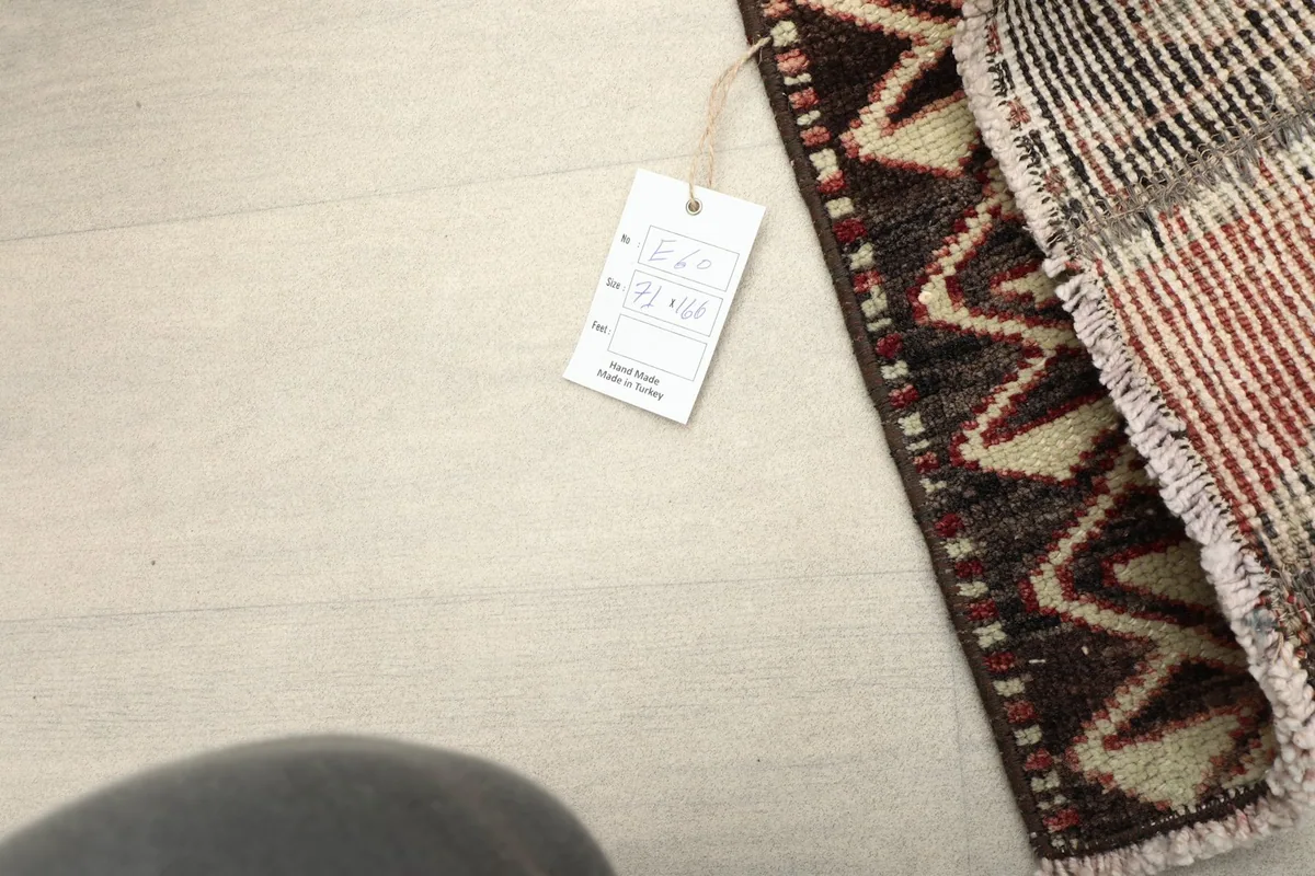 Close-up of the rug's edge with a product tag, indicating its origin from Turkey.