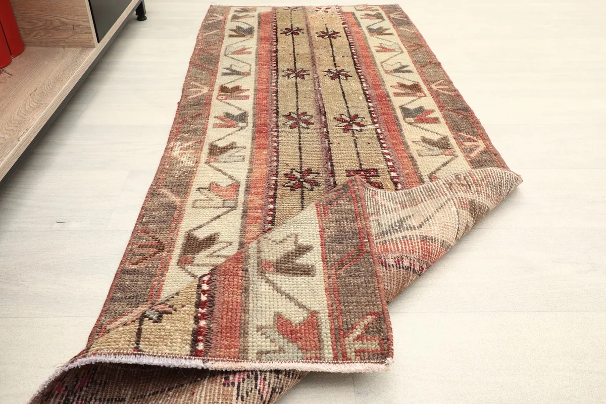 The runner partially folded, showing its flexibility and the consistent pattern from top to underside.