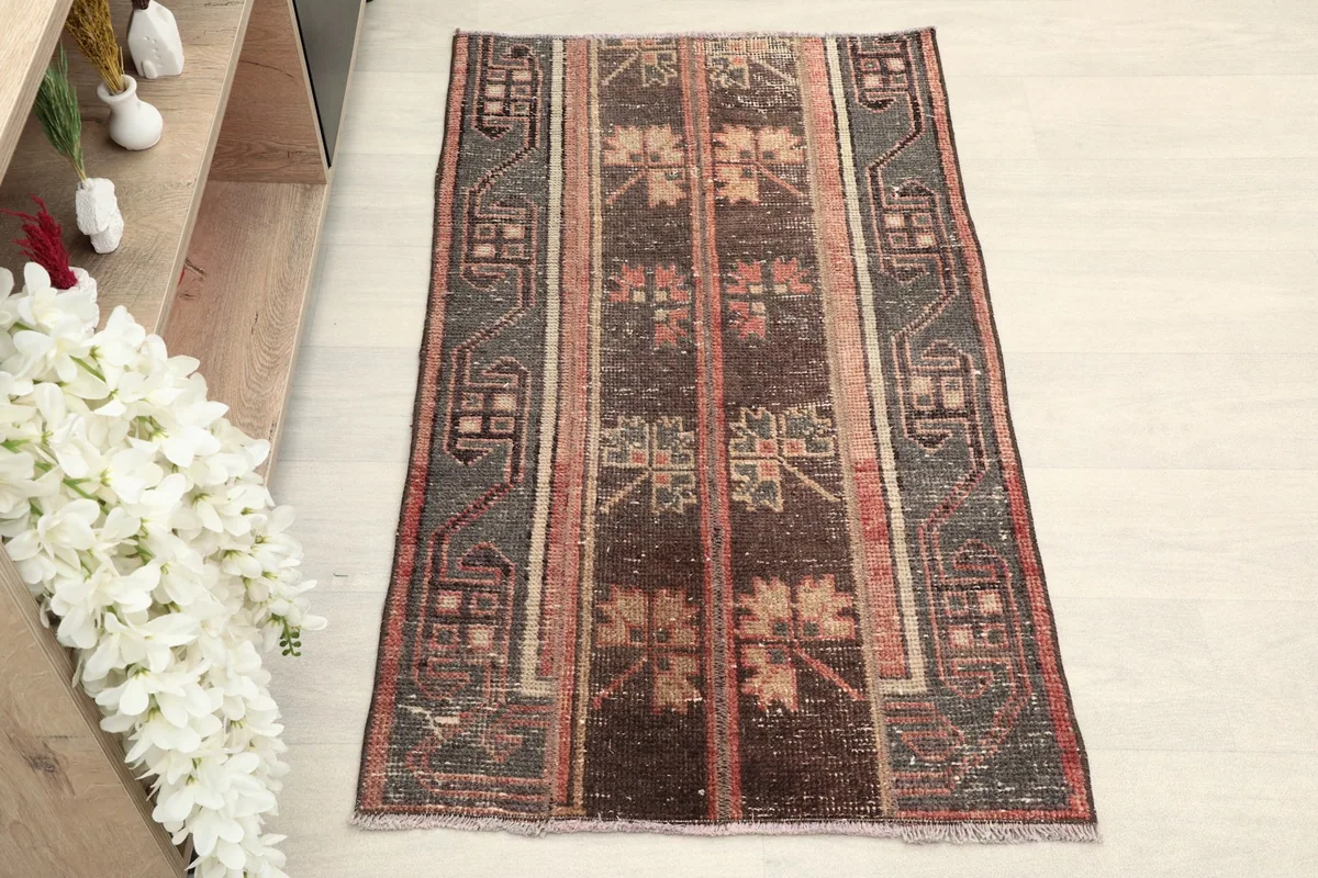 Overhead view of the vintage Anatolian rug, showcasing its full pattern and colors.