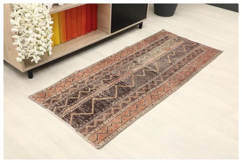 Full top view of the 2'1" x 5'0" vintage Anatolian runner with brown, rust, and beige geometric patterns.