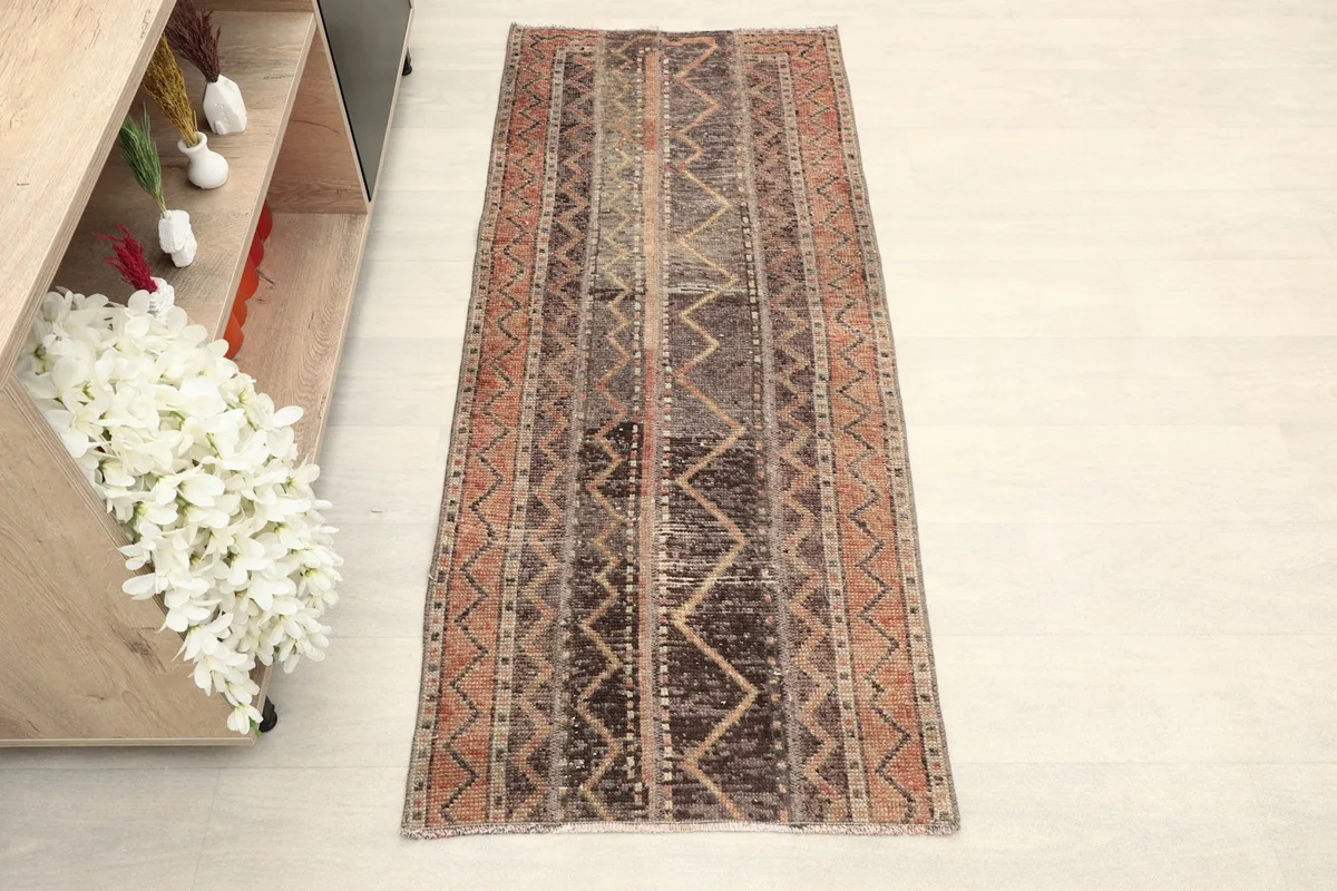 Overhead view of the hand-knotted wool runner, highlighting its full length and tribal design.