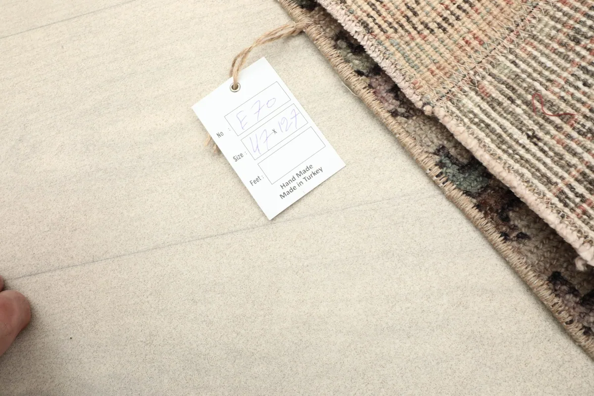 Close-up of the product tag indicating 'Hand Made' and 'made in Turkey'.