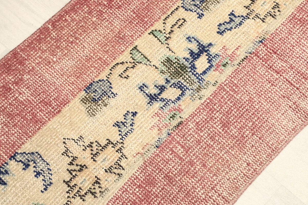 Angled view highlighting the texture of the rose field and the patterns in the beige section