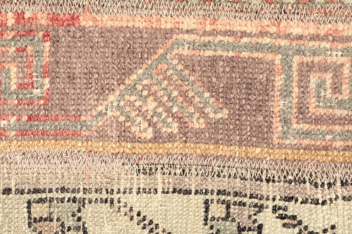 Detailed shot of a specific panel, revealing intricate tribal motifs and color variations.