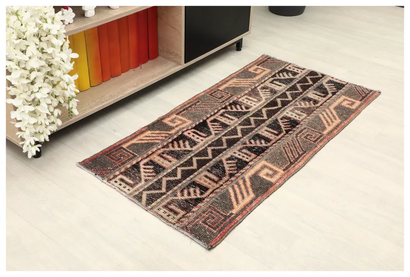 Full top view of the 2'0" x 4'2" vintage Anatolian rug with geometric patterns on a white background.