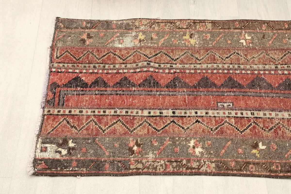 Angled shot from one end of the runner, showing the overall pattern flow and subtle color variations.