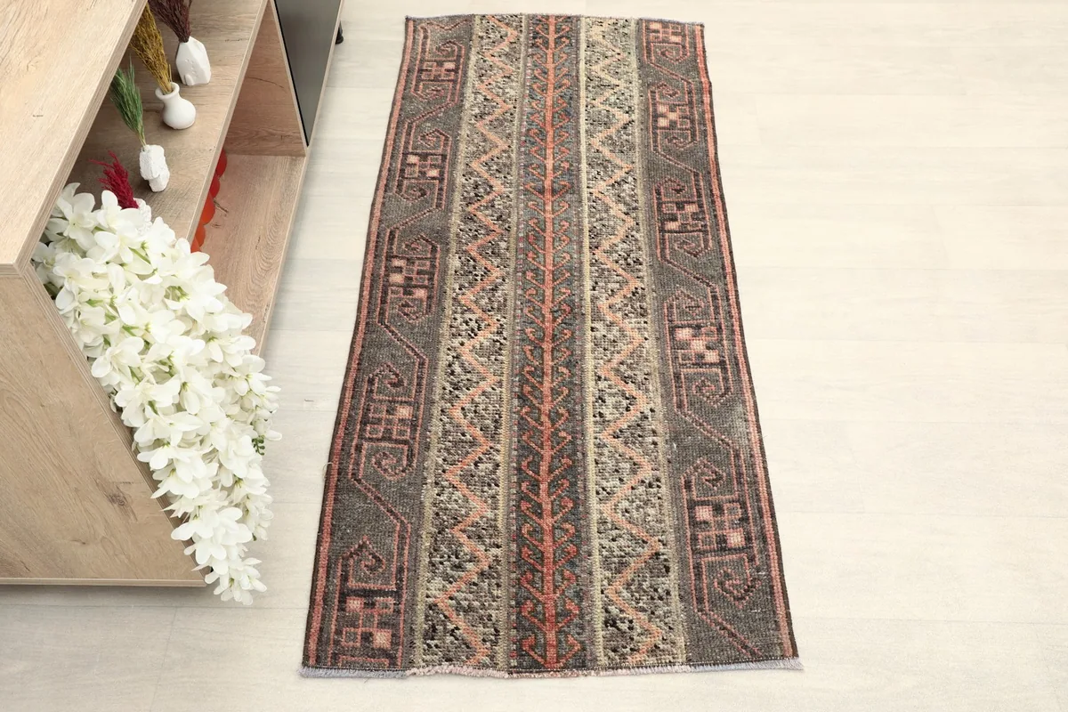 Overhead view of the vintage Anatolian rug, showcasing its full striped pattern and colors.