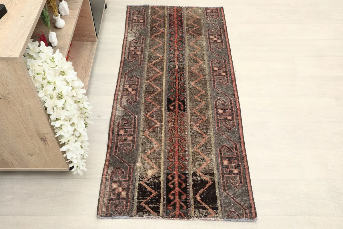 Overhead view of the hand-knotted wool runner showing its full design and colors