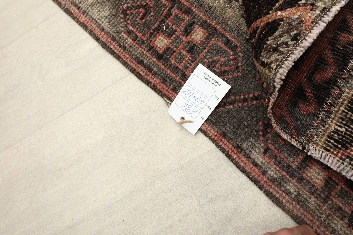 Close-up of the rug's corner with the product tag, showing the reverse side