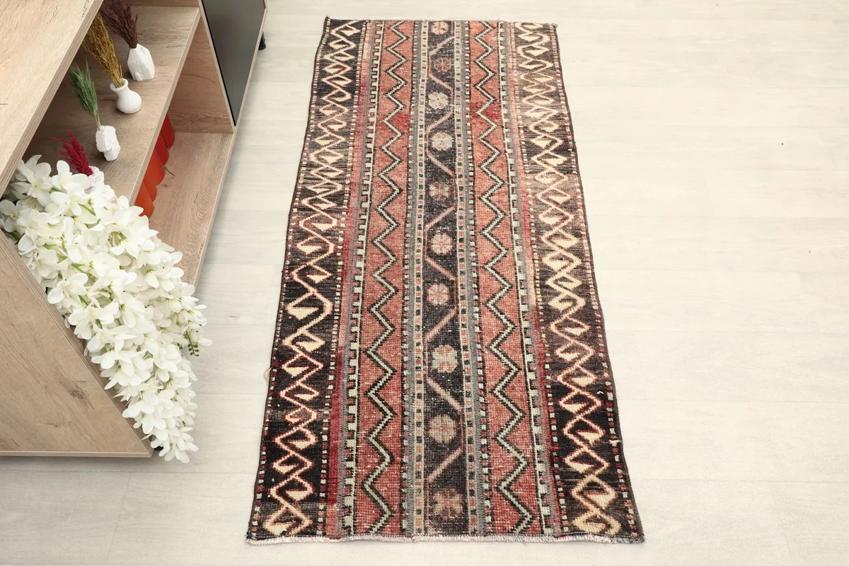 Direct overhead shot of the hand-knotted vintage rug, showing its full design and colors.