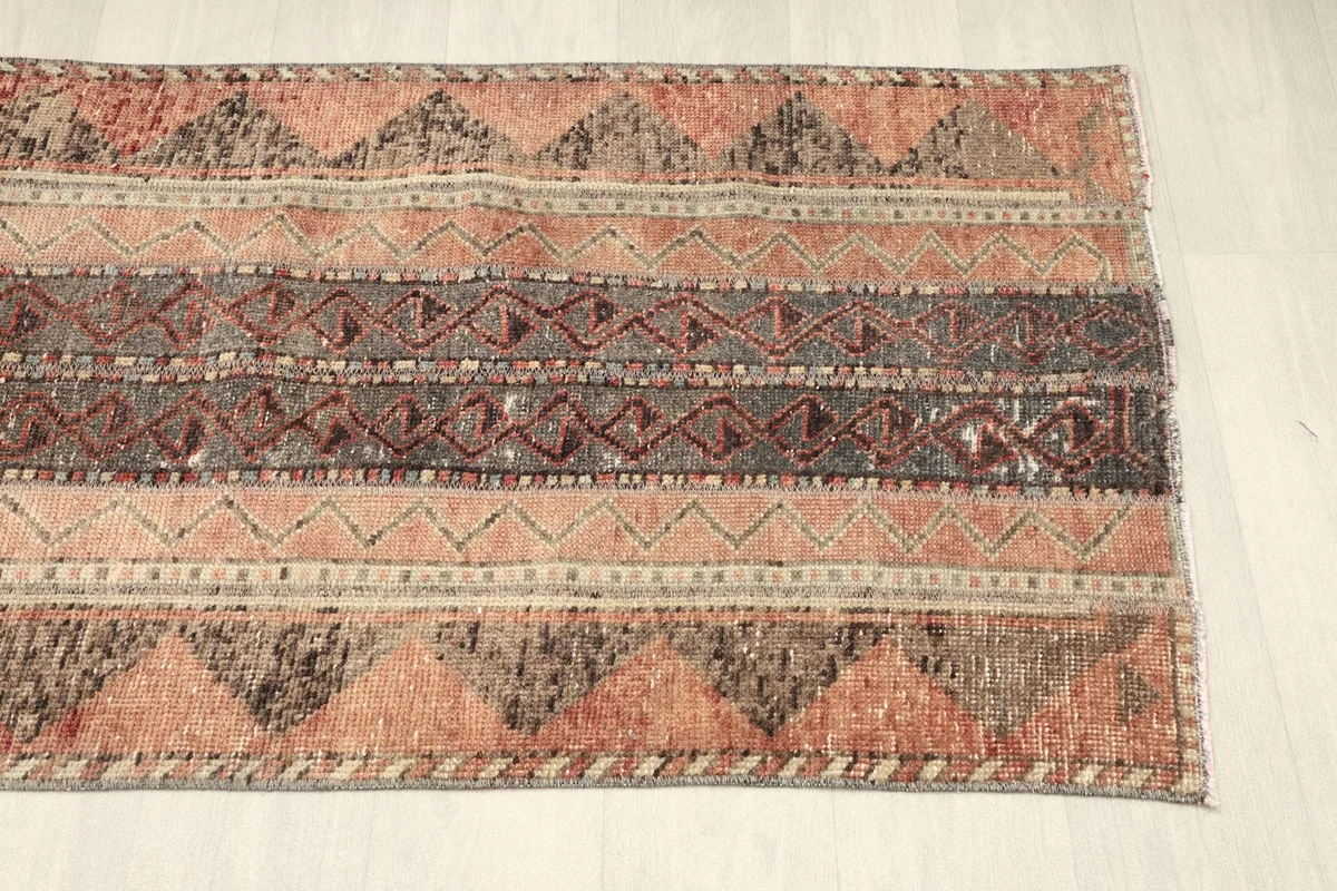 Another detailed section of the runner, emphasizing the alternating striped patterns and color variation.