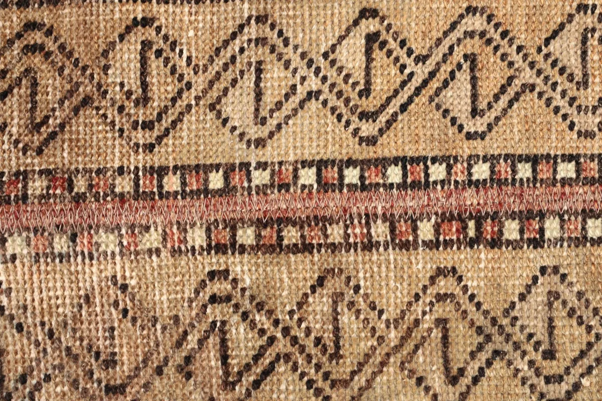 Detailed view of the intricate tribal motifs and color variations