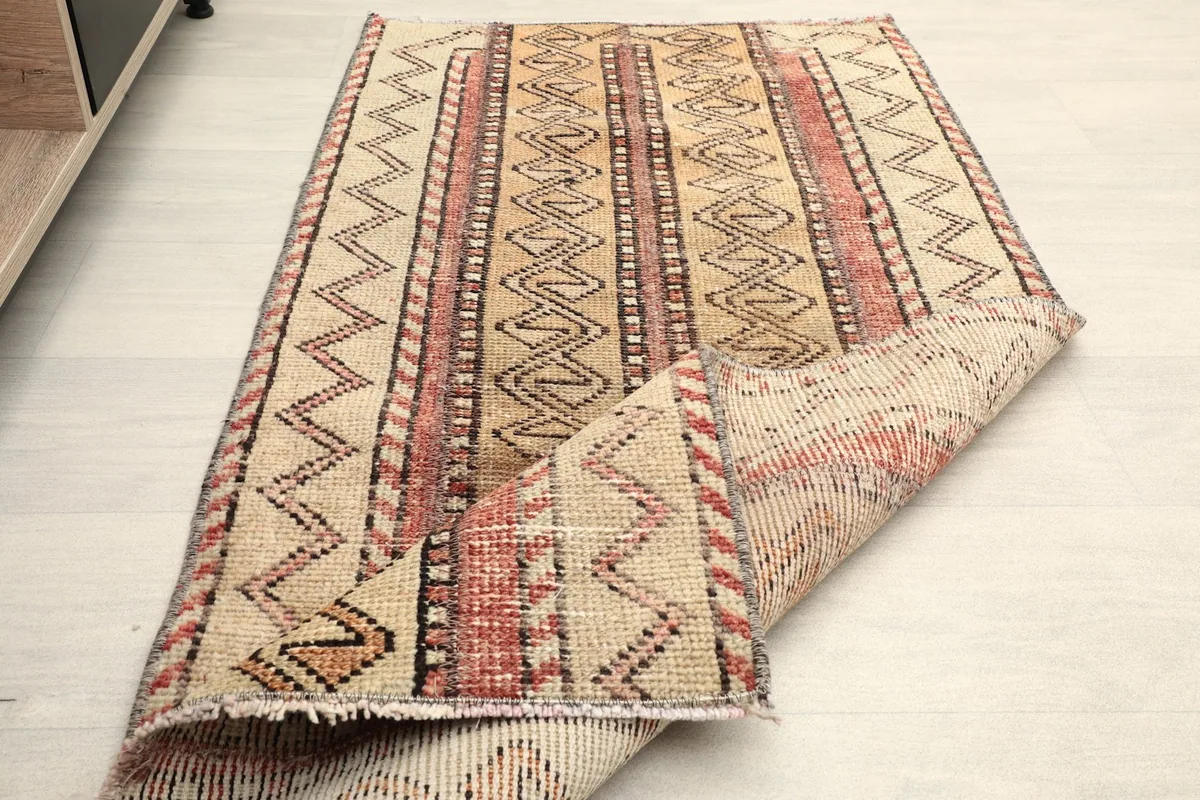 The rug folded to show its flexibility and thickness