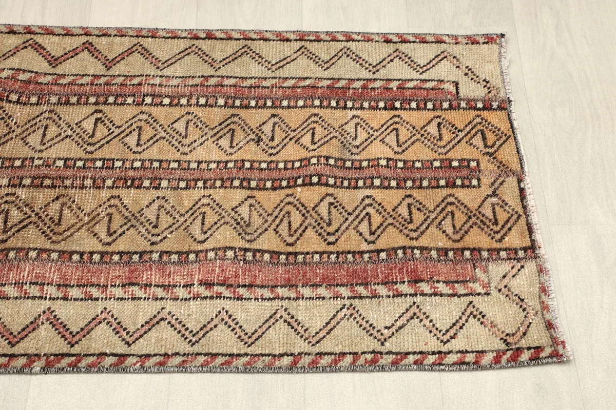 Partial overhead view of the other end of the rug, showing consistent patterning