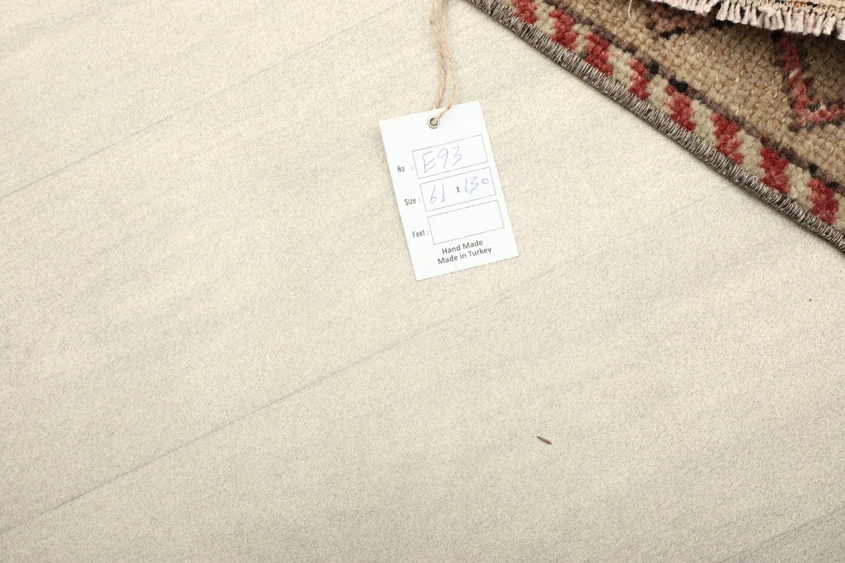 Rug tag indicating hand-knotted wool and origin from Turkey