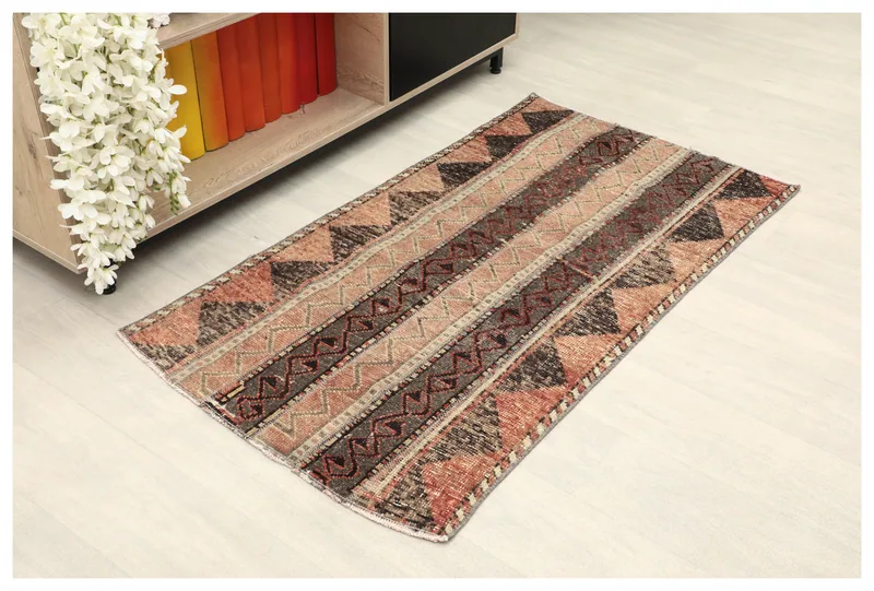 Full top view of the 2x4 vintage Anatolian rug, displaying its striped tribal pattern and rust, black, beige colors.