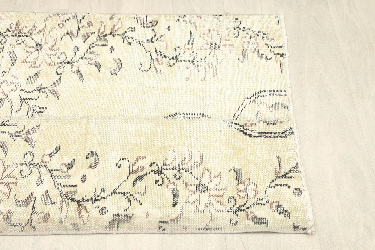 Another angled view, showing the natural patina and vintage character of the rug's surface