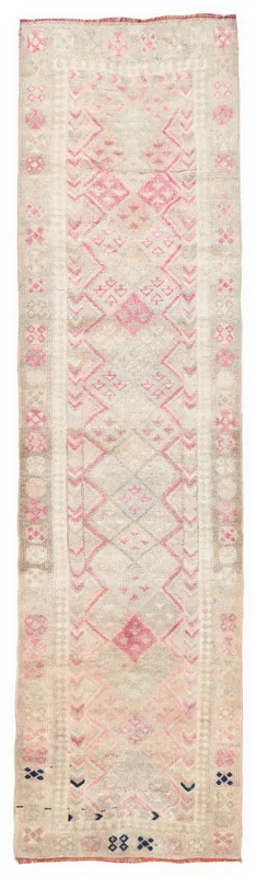 Full overhead view of the beige and pink geometric vintage runner rug