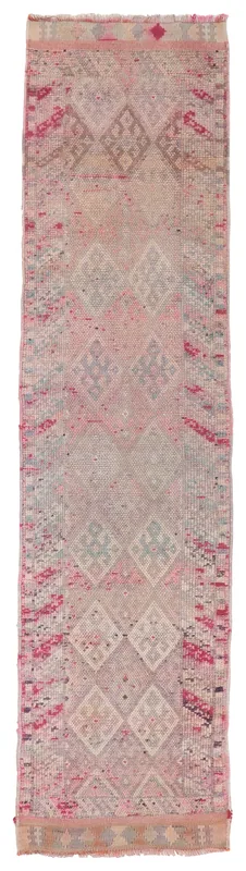 Full overhead view of the vintage rose geometric Anatolian runner on a white background.