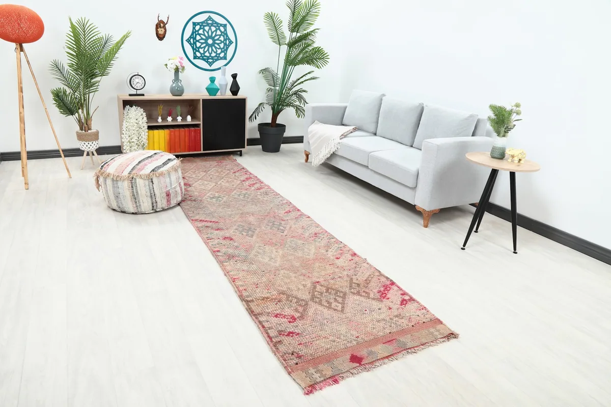 Angle view of the rose runner rug in a contemporary living space, showing its length.