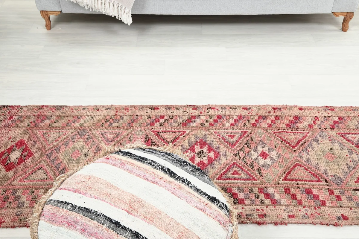 View of the runner rug from above, showing its full length in a room setting