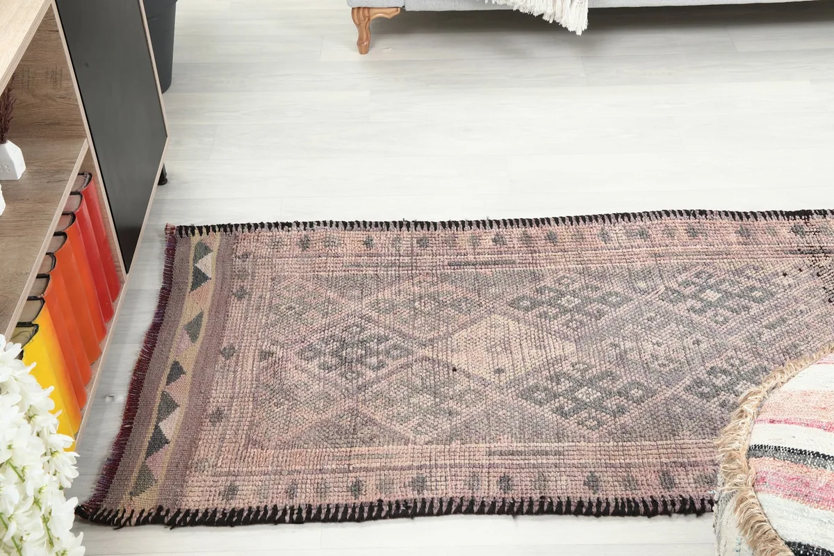 View of the runner rug in a room from a slightly higher angle, emphasizing its fit in a living space.