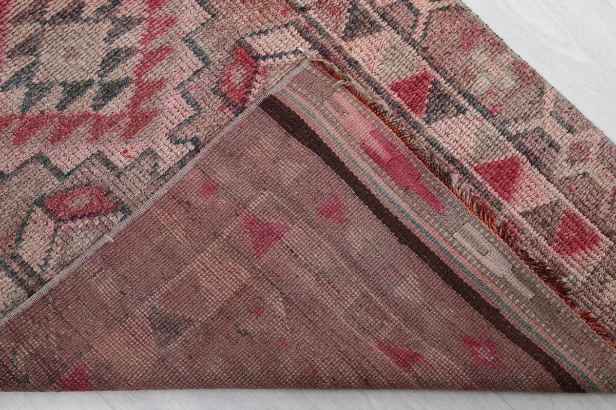 Underside view of the hand-knotted wool pile and cotton foundation of the Anatolian runner