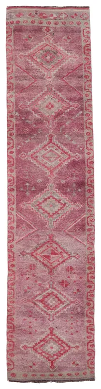 Full top view of the rose geometric Anatolian runner on a white background
