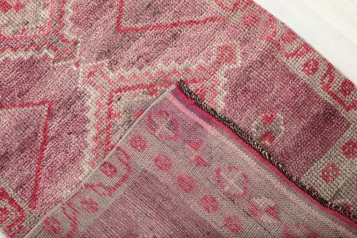 View of the runner's underside, revealing the hand-knotted construction and cotton foundation