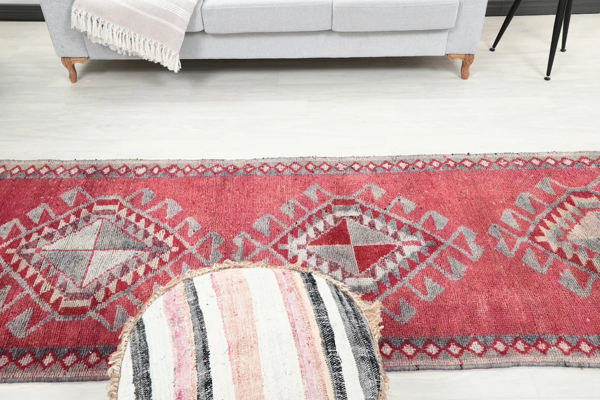 Low angle view of the runner rug in a room, focusing on the texture and color variations.