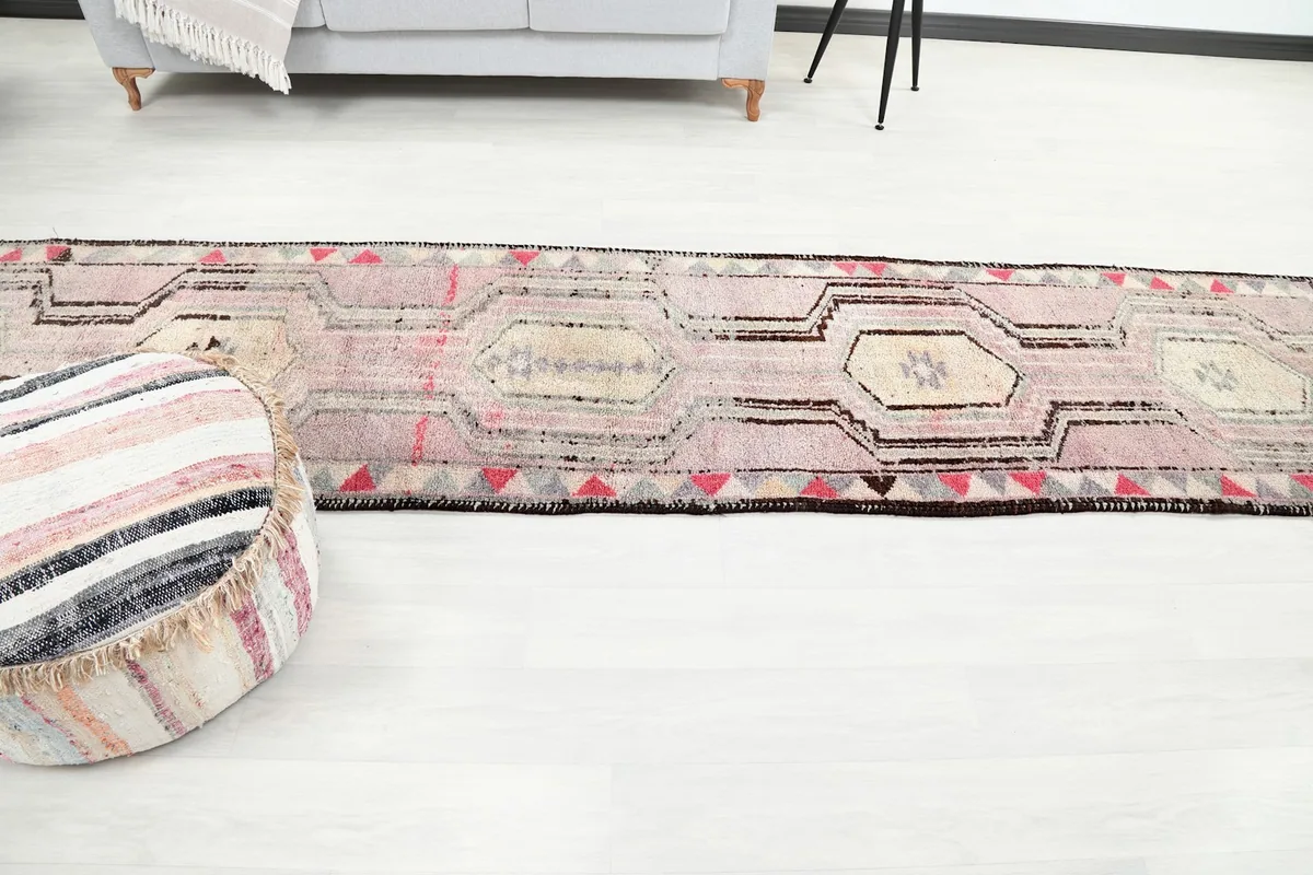 Long view of the runner rug in a living space, showcasing its length and placement.