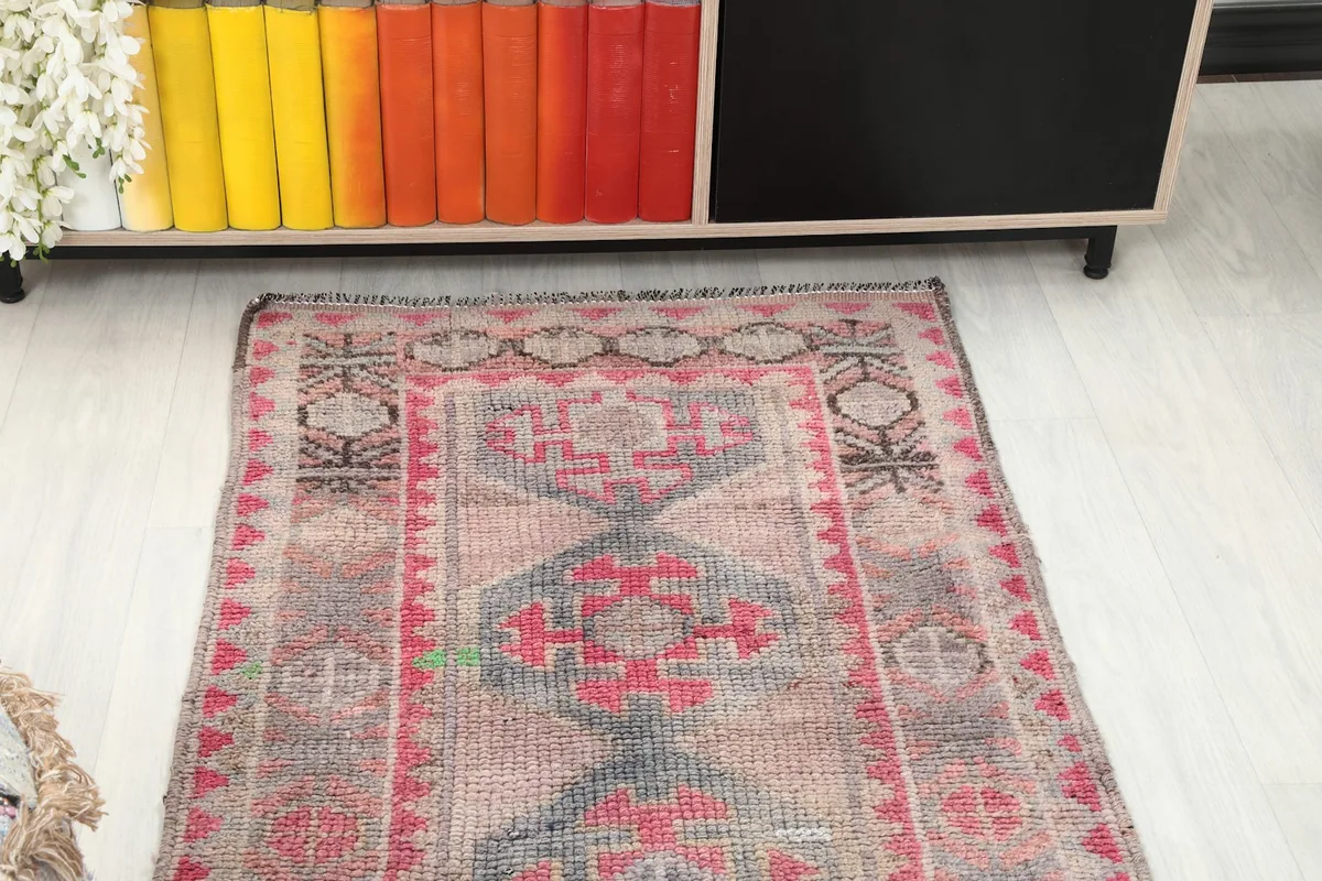 Top-down view of one end of the runner rug in a room setting