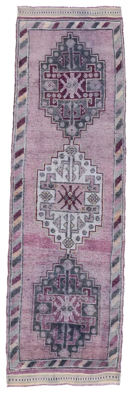 Full top view of the 3'1" x 10'10" hand-knotted vintage Anatolian runner rug with rose and gray tribal patterns.