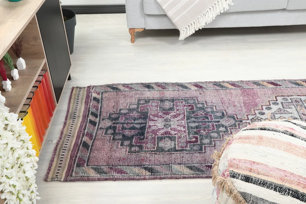 View of the runner rug extending into a living space, demonstrating its suitability for hallways.