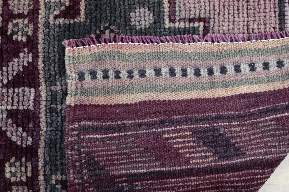 Close-up of the back of the rug, showing the details of the hand-knotted construction.