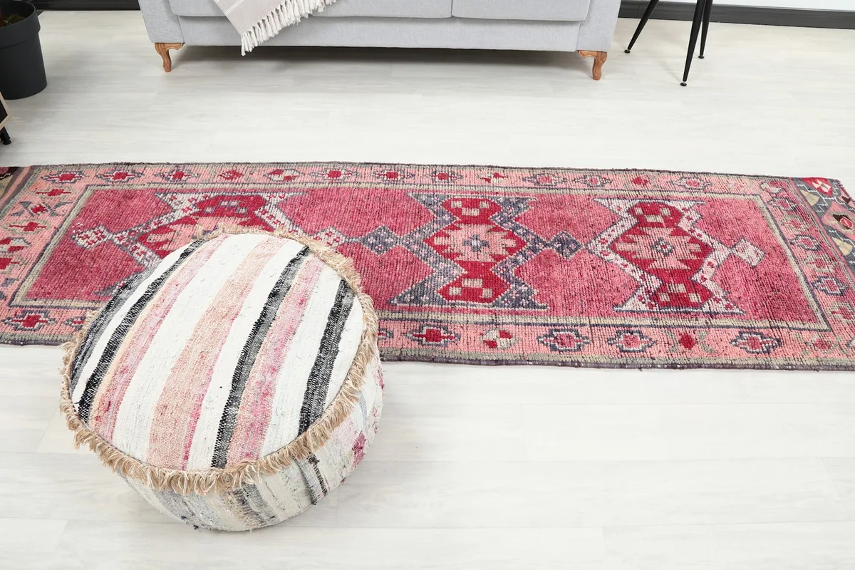 Full length view of the runner rug in a room, highlighting its proportion.
