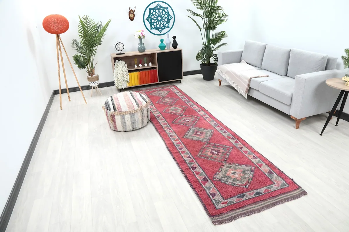 Angle view of the rose geometric runner rug in a contemporary living space with neutral decor.