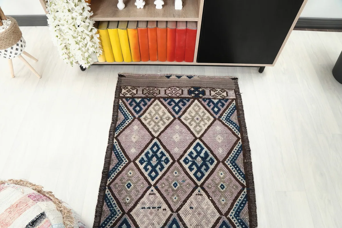 Overhead view of a section of the runner rug, showcasing the full geometric design