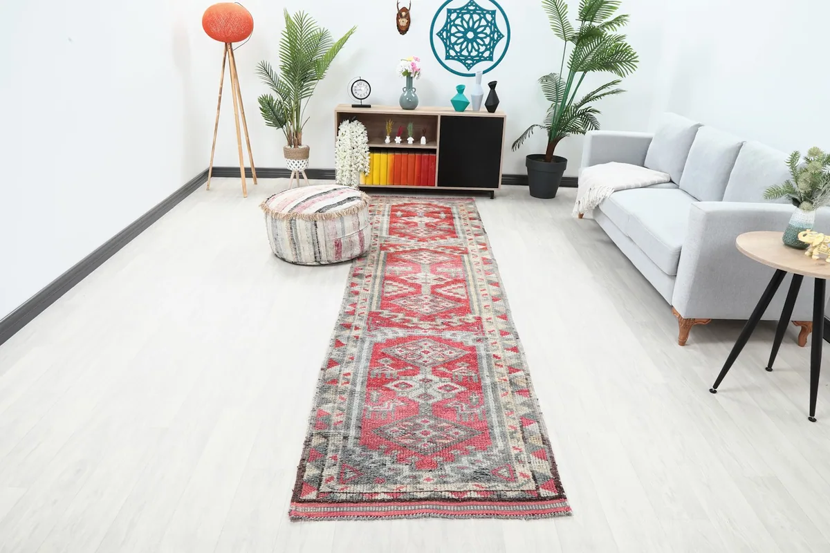 Runner rug displayed in a modern living room setting, showing its length and colors.