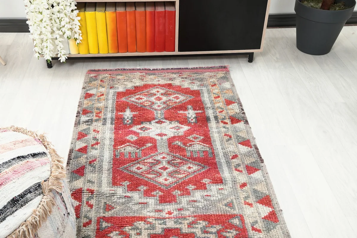 Overhead view of a section of the runner rug in a room, showing its geometric design.