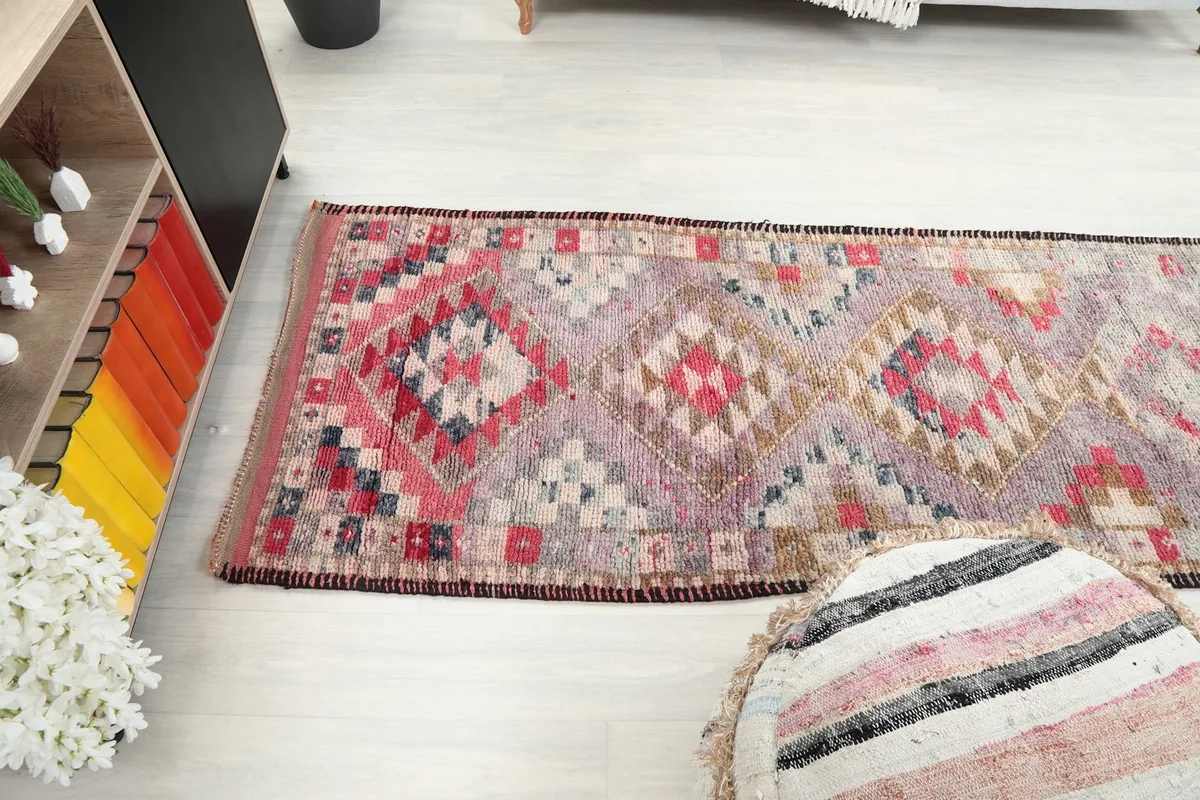 Angled view of the runner rug showing its length and various geometric patterns