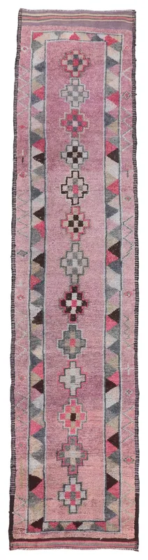 Full top view of the 2'11" x 13'3" rose vintage runner rug with tribal geometric patterns