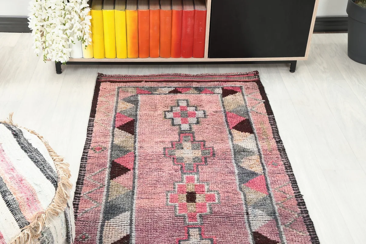 Overhead view of the runner rug in a room setting, focusing on the central design and colors