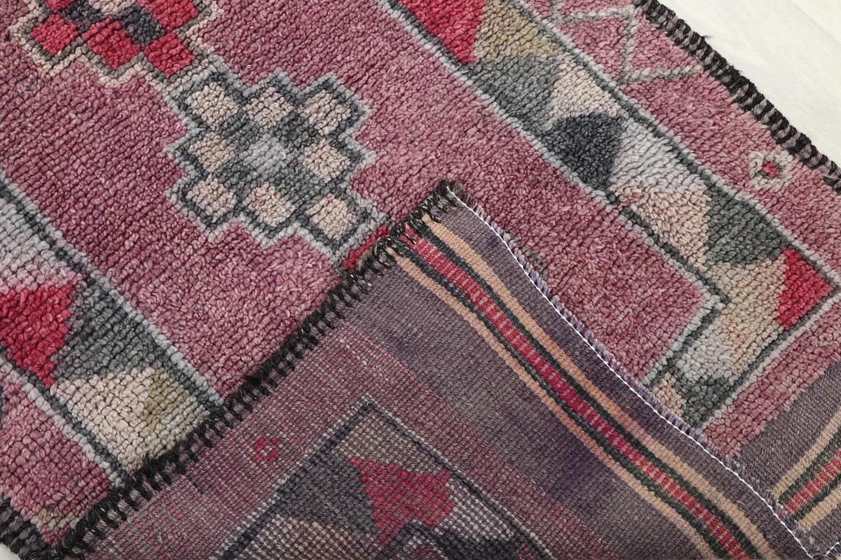 Close-up of the rug's back, revealing the cotton foundation and tight hand-knotting